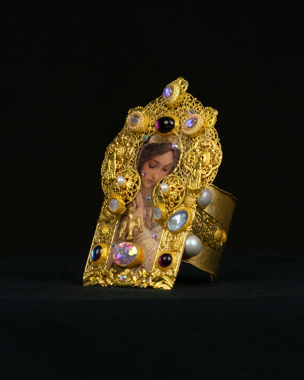 Side view of gold filigree reliquary cuff bracelet with vintage cabochons, Queen Swan collection by Svetlana Kisselev