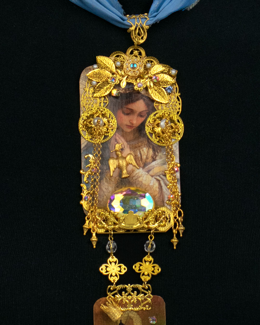 Detail of gold filigree reliquary pendant with faceted crystal and freshwater pearls, Queen Swan collection