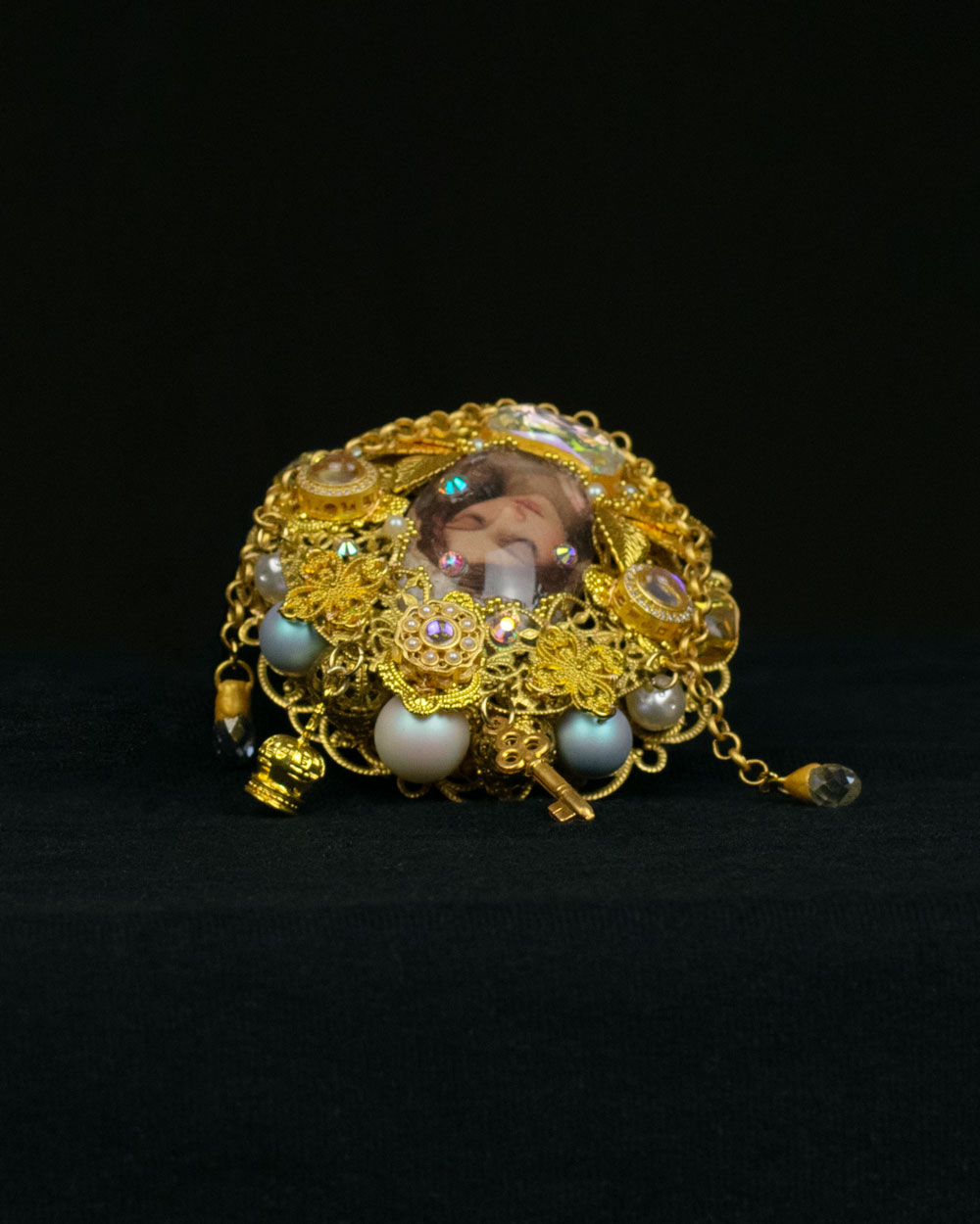 Close-up of hand-painted glass cabochon centerpiece on Orthodox-influenced statement ring, wearable maximalist baroque-influenced reliquary art